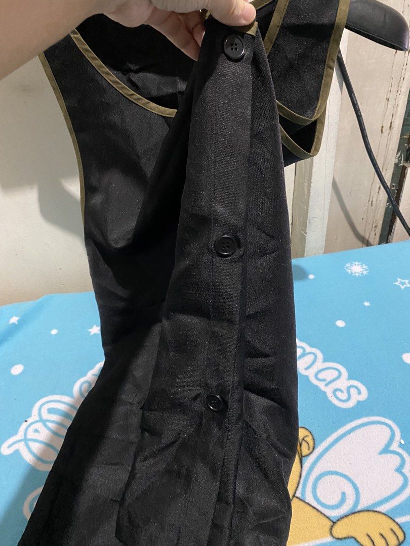 Black Apron with Side Buttons and Pockets (Category: Coats, Jackets and Outerwear) located in Manila. Submitted by resi.diaz (Listing ID 1456539070, Image 3). Description: - Black apron with stylish olive green trim - Two convenient front pockets - Easy side button closure - Versatile for cooking, crafting, work, or home use - Simple to wear and maintain (easy to clean).