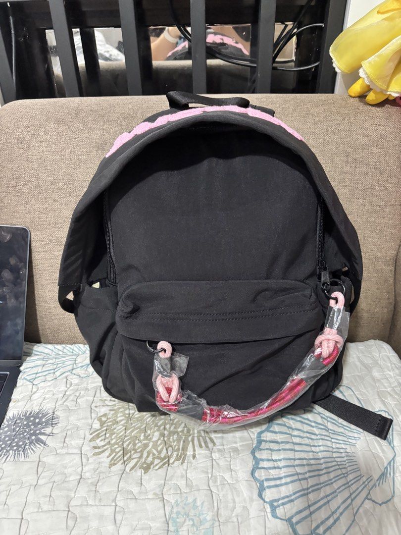 Black Mickey Mouse Backpack with Pink Accents (Category: Backpacks) located in Mexico. Submitted by 3everything (Listing ID 1456483542, Image 1). Description: - Cute black backpack with pink 'MICKEY' lettering - Front pocket and side pockets for extra storage - Light beige interior with a small pocket - Adjustable straps for a comfortable fit - Ideal for school or everyday use - parang nakahoodie yung bag.