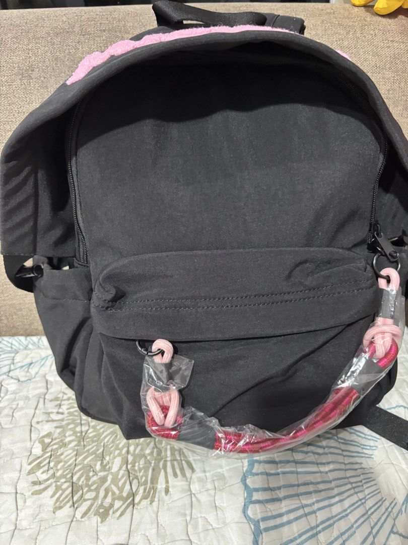 Black Mickey Mouse Backpack with Pink Accents (Category: Backpacks) located in Mexico. Submitted by 3everything (Listing ID 1456483542, Image 3). Description: - Cute black backpack with pink 'MICKEY' lettering - Front pocket and side pockets for extra storage - Light beige interior with a small pocket - Adjustable straps for a comfortable fit - Ideal for school or everyday use - parang nakahoodie yung bag.