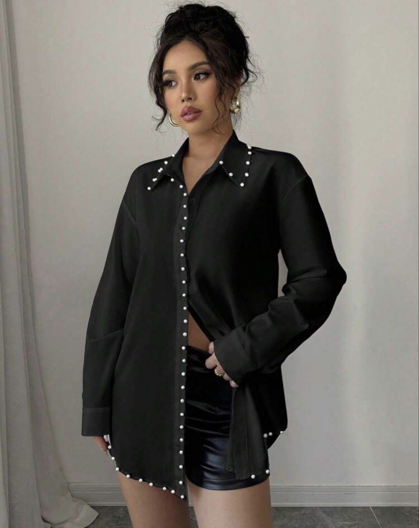 Black Pearl Embellished Button-Up Shirt (Category: Shirts) located in Cebu City. Submitted by iamgee89 (Listing ID 1456475115, Image 2). Description: - Chic black long-sleeve shirt - Exquisite pearl embellishments along the collar and front buttons - Asymmetrical hemline also features pearl detailing - Effortlessly transitions from dressed up to dressed down - Ideal for a sophisticated night out or a stylish daytime ensemble.