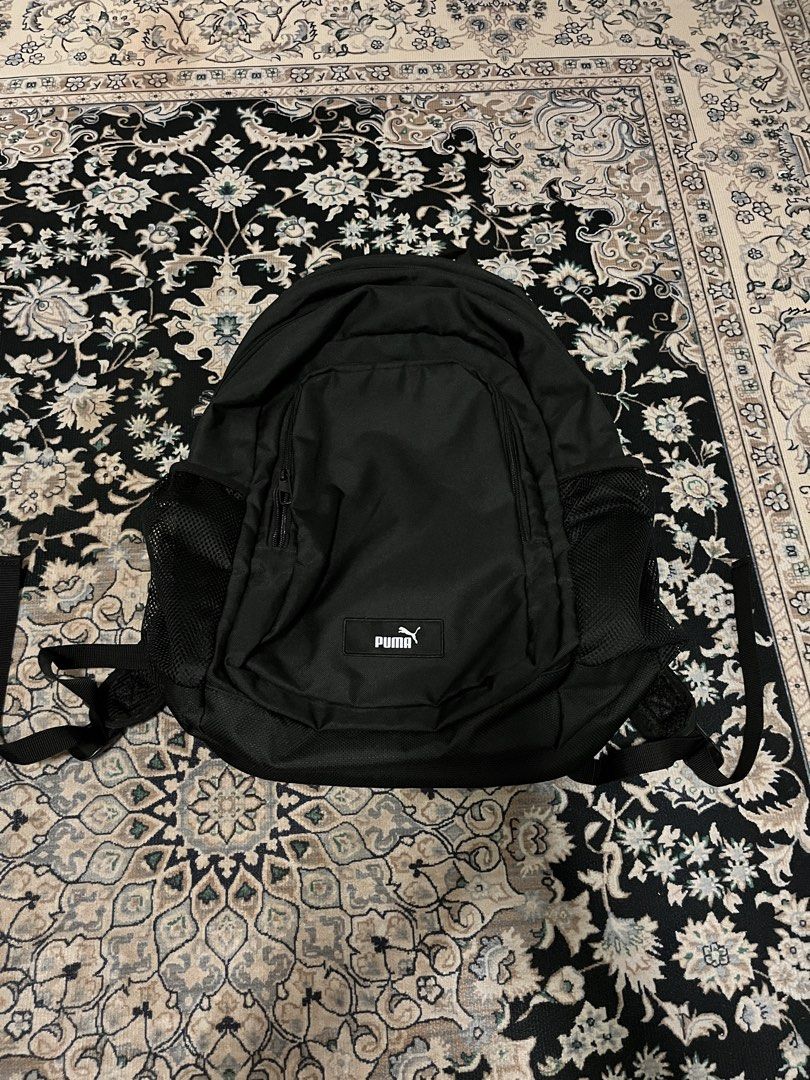 Black Puma Backpack (Category: Backpacks) located in Kuala Lumpur. Submitted by nurulaliya00 (Listing ID 1456576921, Image 1). Description: Classic black Puma backpack. Has a main compartment and a front zip pocket. Side mesh pockets for water bottles or small items. Padded straps for comfort. Great for school, gym, or everyday use. Simple and functional design. Can put your laptop also.