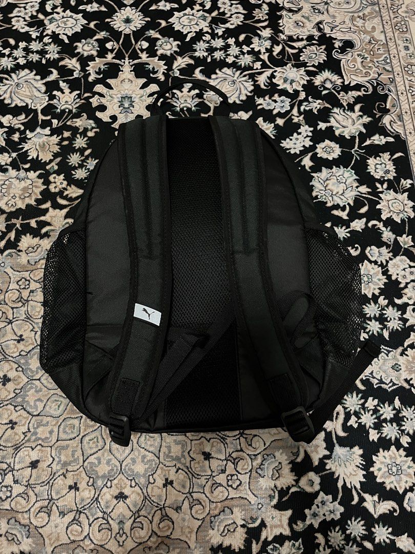 Black Puma Backpack (Category: Backpacks) located in Kuala Lumpur. Submitted by nurulaliya00 (Listing ID 1456576921, Image 2). Description: Classic black Puma backpack. Has a main compartment and a front zip pocket. Side mesh pockets for water bottles or small items. Padded straps for comfort. Great for school, gym, or everyday use. Simple and functional design. Can put your laptop also.