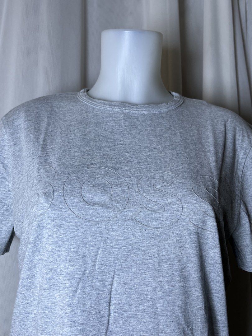 BOSS Grey T-Shirt with Embossed Logo (Category: Tshirts & Polo Shirts ) located in Bulacan. Submitted by stacksonracks_ph (Listing ID 1456443198, Image 2). Description: - Brand: BOSS - Color: Grey - Size: S - Features: Embossed BOSS logo on chest - Neckline: Crew neck - Sleeves: Short sleeves - Material: Comfortable fabric - Style: Great for casual wear - Care: Check label for instructions.