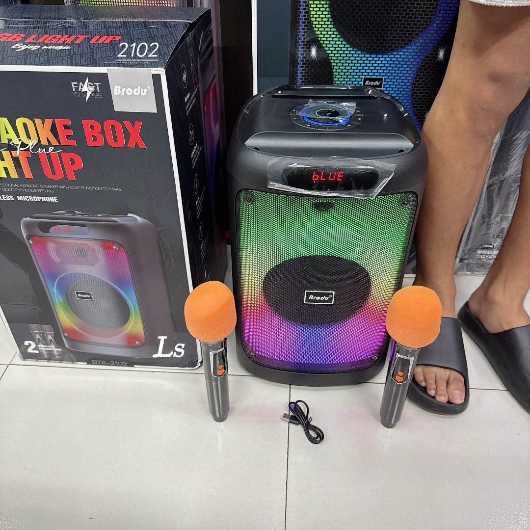 Brodu BTS-2102 Karaoke Box Speaker with 2 Microphones (Category: Soundbars, Speakers & Amplifiers) located in Manila. Submitted by chaionlineshop (Listing ID 1456508914, Image 2). Description: - Karaoke Speaker Model: BTS-2102 - Features vibrant RGB lighting - Includes two microphones - Comes with a charging cable - Wireless connectivity via Bluetooth - Ideal for parties and singing sessions - Easy to use: lights up and plays music.