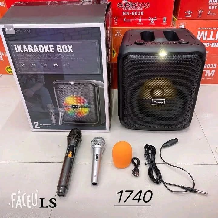 Brody BTS-1740 iKaraoke Box Bluetooth Speaker with 2 Mics (Category: Soundbars, Speakers & Amplifiers) located in Manila. Submitted by chaionlineshop (Listing ID 1456504164, Image 2). Description: - Portable iKaraoke Box with Bluetooth - Includes 2 microphones (1 wireless, 1 wired) - Comes with an orange mic cover - Features LED lights on the speaker - Connects via AUX and FM Radio - Rechargeable via USB - Ideal for parties and singing sessions.
