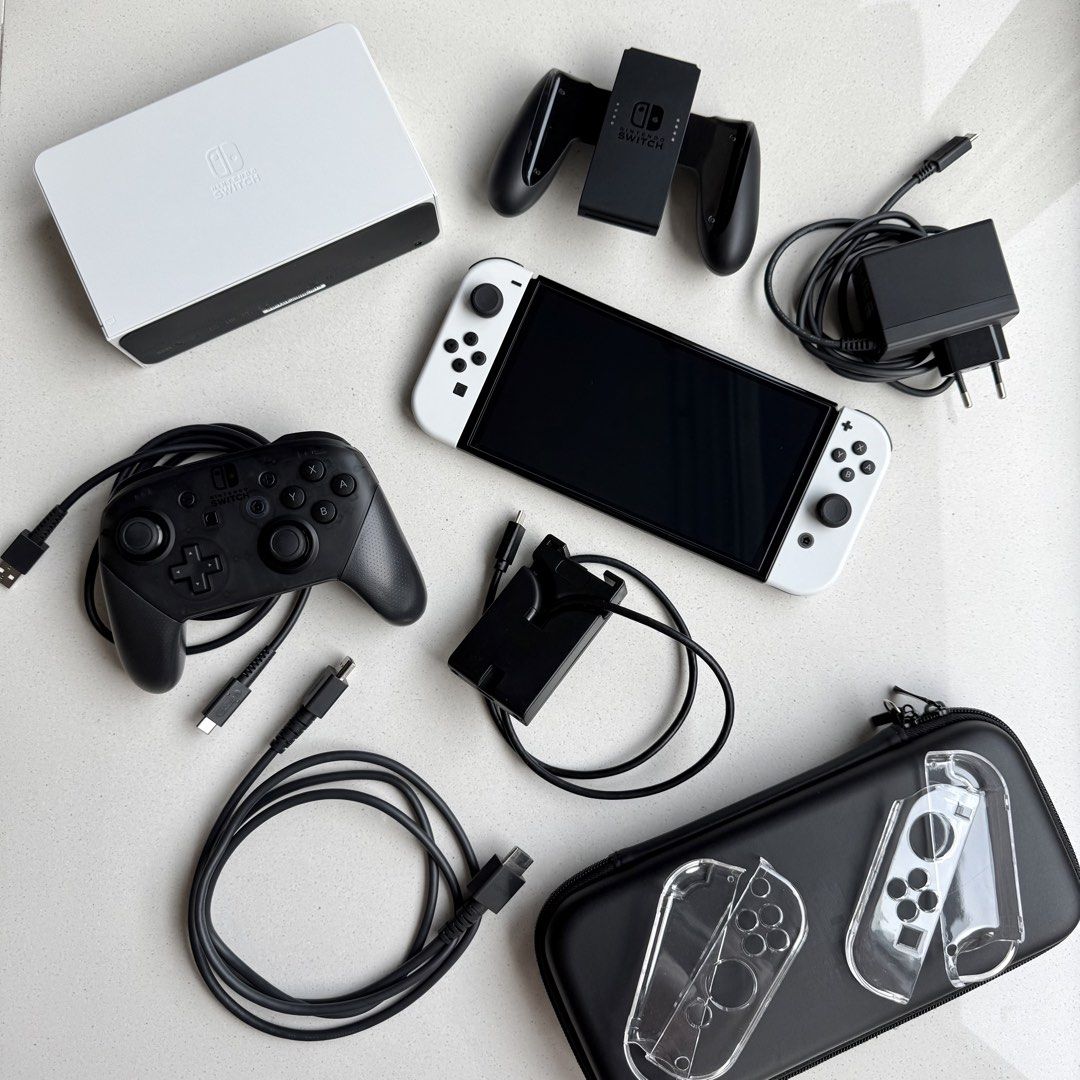[BUNDLE] Nintendo Switch OLED + Switch Pro Controller + Accessories (Category: Nintendo) located in Singapore. Submitted by pumpernicolebread (Listing ID 1456515772, Image 1). Description: PRICE STATED INCLUDES EVERYTHING SHOWN IN THE FIRST PICTURE. I will not sell them separately. Please collect these items at my house (Serangoon Gardens area) as I don't want it to get damaged during delivery. Please note that full payment has to be made via Pay