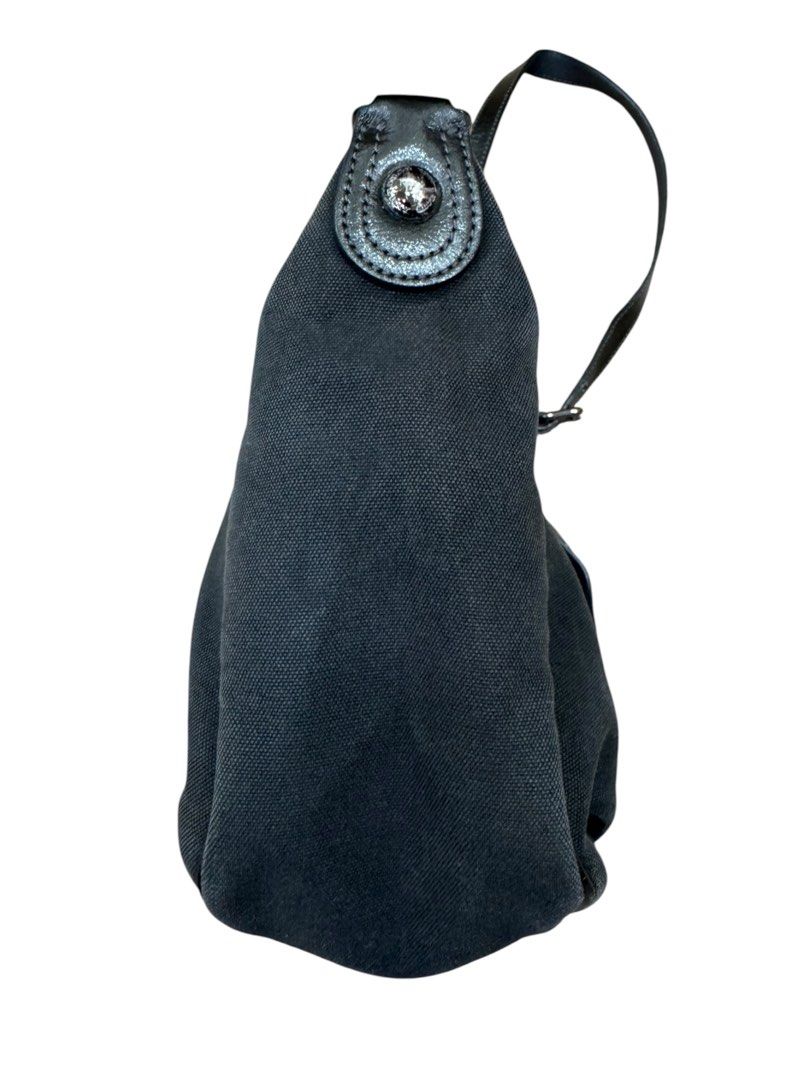 Burberry Blue Label Shoulder Bag (Category: Luxury Bags & Wallets) located in San Fernando. Submitted by northerncloset330 (Listing ID 1456552390, Image 3). Description: timeless piece from the highly collectible, Japan-exclusive diffusion line produced by Sanyo Shokai. Crafted from structurally sound, matte black canvas, the bag displays a minimalist baguette-style silhouette with subtle pleating along the base to expand its carrying capacity. T