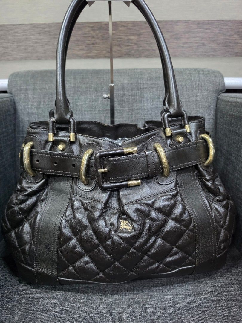 Burberry Quilted Leather Tote Bag (Category: Luxury Bags & Wallets) located in General Trias. Submitted by roselle2230 (Listing ID 1456544233, Image 1). Description: - Authentic Black Burberry tote bag - Luxurious quilted leather with elegant gold-tone hardware - Adjustable straps with stylish buckle details - Signature green interior lining - Proudly 'Made in Italy' - A timeless and versatile piece for your daily essentials.