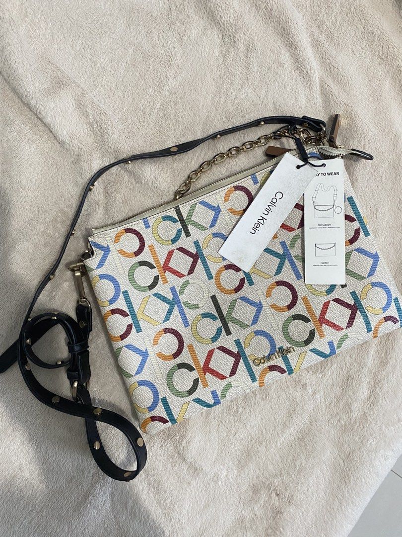 Calvin Klein Multicolor Rainbow Monogram Crossbody Bag (Category: Luxury Bags & Wallets) located in Davao. Submitted by sweeetooth10 (Listing ID 1456463713, Image 1). Description: Calvin Klein Multicolor Rainbow Monogram Crossbody Bag Used once, still has its tag Pm for more deets.