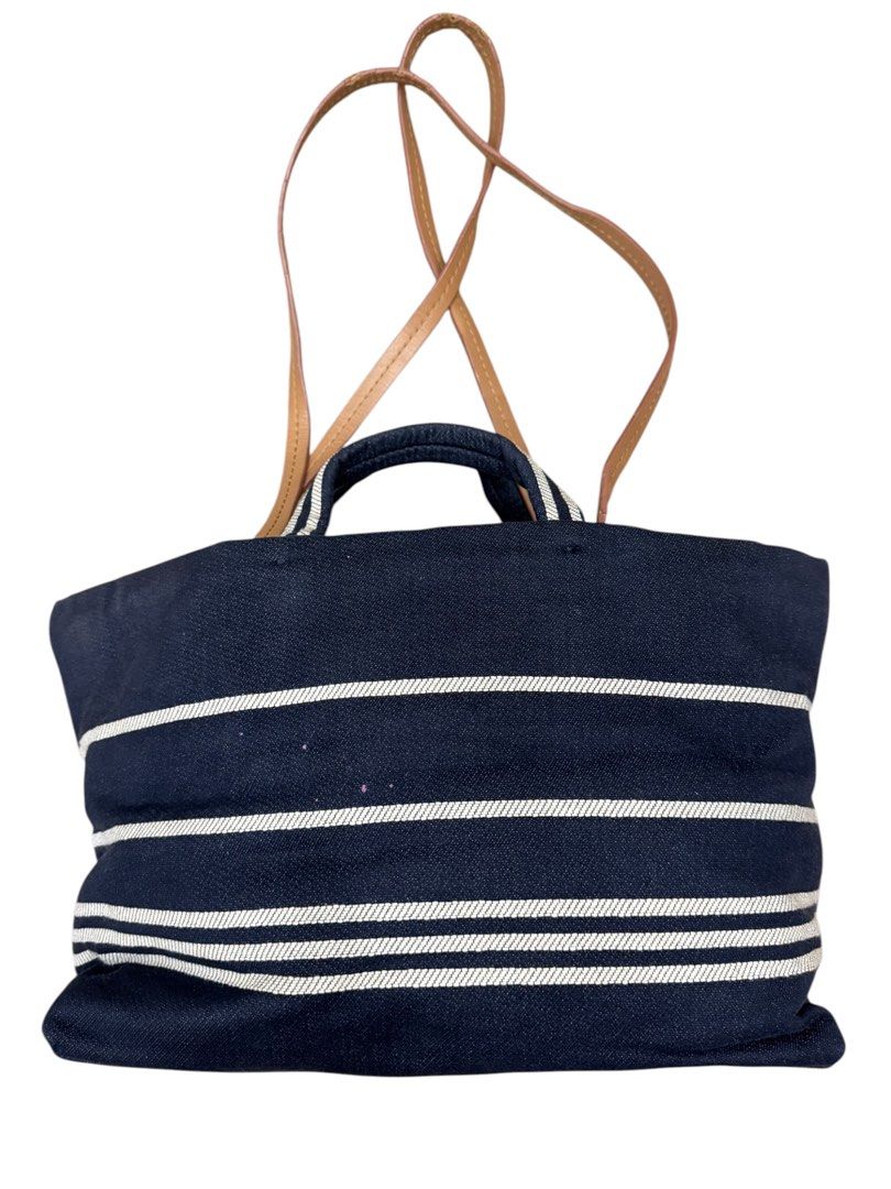 Chanel Striped Denim CC Shopping (Category: Luxury Bags & Wallets) located in San Fernando. Submitted by northerncloset330 (Listing ID 1456554977, Image 3). Description: Part of the Chanel 2014 Cruise Collection envisioned by Karl Lagerfeld, this Chanel Denim CC Shopping Tote beautifully merges nautical maritime style with quintessential Parisian luxury. The bag is crafted from structurally resilient, deep navy blue denim canvas. It is strikingly