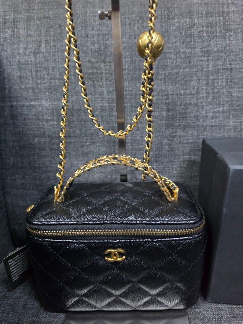 Chanel Vanity Case Bag Black Caviar Gold Hardware (Category: Luxury Bags & Wallets) located in General Trias. Submitted by roselle2230 (Listing ID 1456544474, Image 3). Description: - Authentic Chanel Vanity Case Bag - Color: Black - Material: Caviar Leather - Iconic Diamond Quilting - Signature CC Logo - Gold Chain Strap - Adorable Gold Ball Charm - Interior lined with 'Chanel Made in Italy' tag - Comes with original Chanel Makeup box.