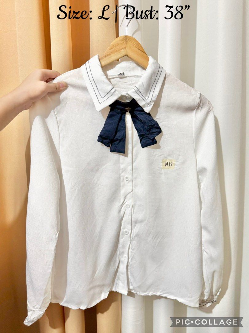 Chic Ribbon Tie Collared Blouse (Category: Longsleeves) located in Quezon City. Submitted by everydayessentialsstudio (Listing ID 1456500526, Image 1). Description: A classic white button-down blouse elevated with a detachable ribbon tie, making it perfect for office wear, school, or elegant casual outfits. 📌 Features: • Classic collared neckline • Detachable ribbon tie • Button-down front • Long sleeves • Smart and versatile style • Preloved #E