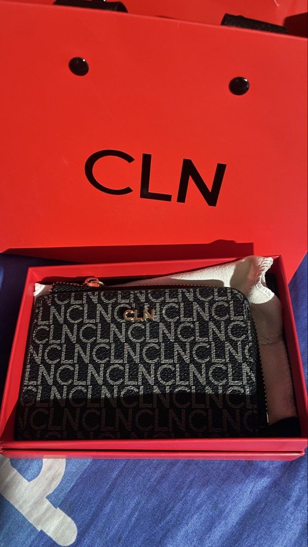 CLN Monogram Zip Around Wallet (Category: Wallets & Card holders) located in Manila. Submitted by cybeeeeee (Listing ID 1456531287, Image 1). Description: - CLN monogram wallet - Black and grey pattern with gold CLN logo - Zipper closure - Comes with dust bag and original box - Ideal for storing cards and coins.