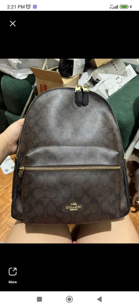 Coach Charlie large backpack (Category: Luxury Bags & Wallets) located in Makati City. Submitted by your_preloved (Listing ID 1456483944, Image 1). Description: - Classic Coach backpack in signature monogram print - Color: Brown and black - Material: Leather trim and straps - Hardware: Gold-tone - Pockets: Front zip pocket, main compartment, side pockets - Ideal for: Everyday use or travel - Features: Plenty of interior space.