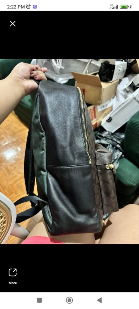 Coach Charlie large backpack (Category: Luxury Bags & Wallets) located in Makati City. Submitted by your_preloved (Listing ID 1456483944, Image 2). Description: - Classic Coach backpack in signature monogram print - Color: Brown and black - Material: Leather trim and straps - Hardware: Gold-tone - Pockets: Front zip pocket, main compartment, side pockets - Ideal for: Everyday use or travel - Features: Plenty of interior space.