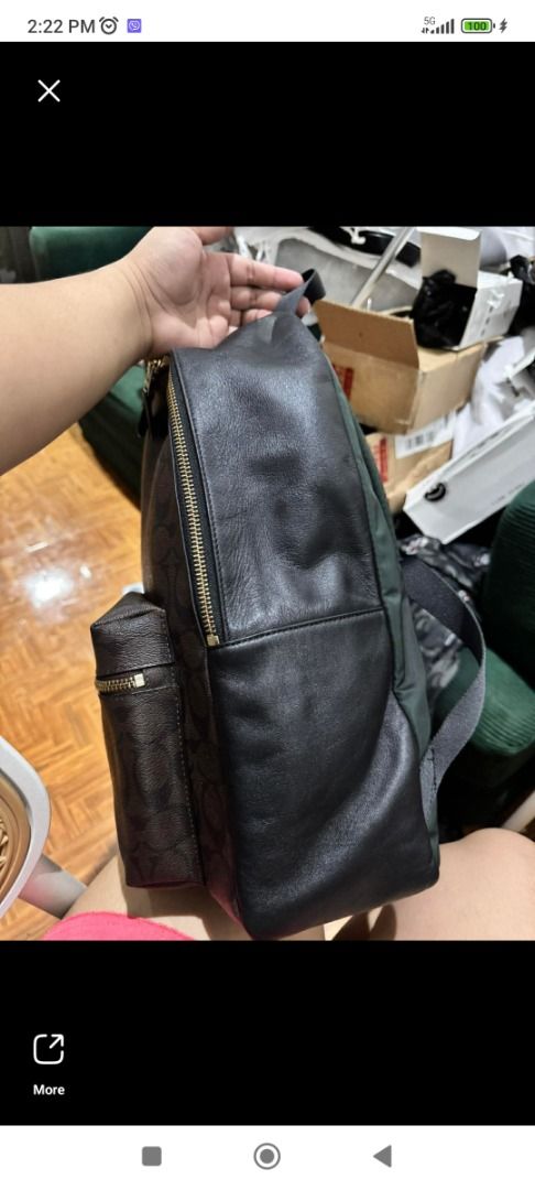Coach Charlie large backpack (Category: Luxury Bags & Wallets) located in Makati City. Submitted by your_preloved (Listing ID 1456483944, Image 3). Description: - Classic Coach backpack in signature monogram print - Color: Brown and black - Material: Leather trim and straps - Hardware: Gold-tone - Pockets: Front zip pocket, main compartment, side pockets - Ideal for: Everyday use or travel - Features: Plenty of interior space.