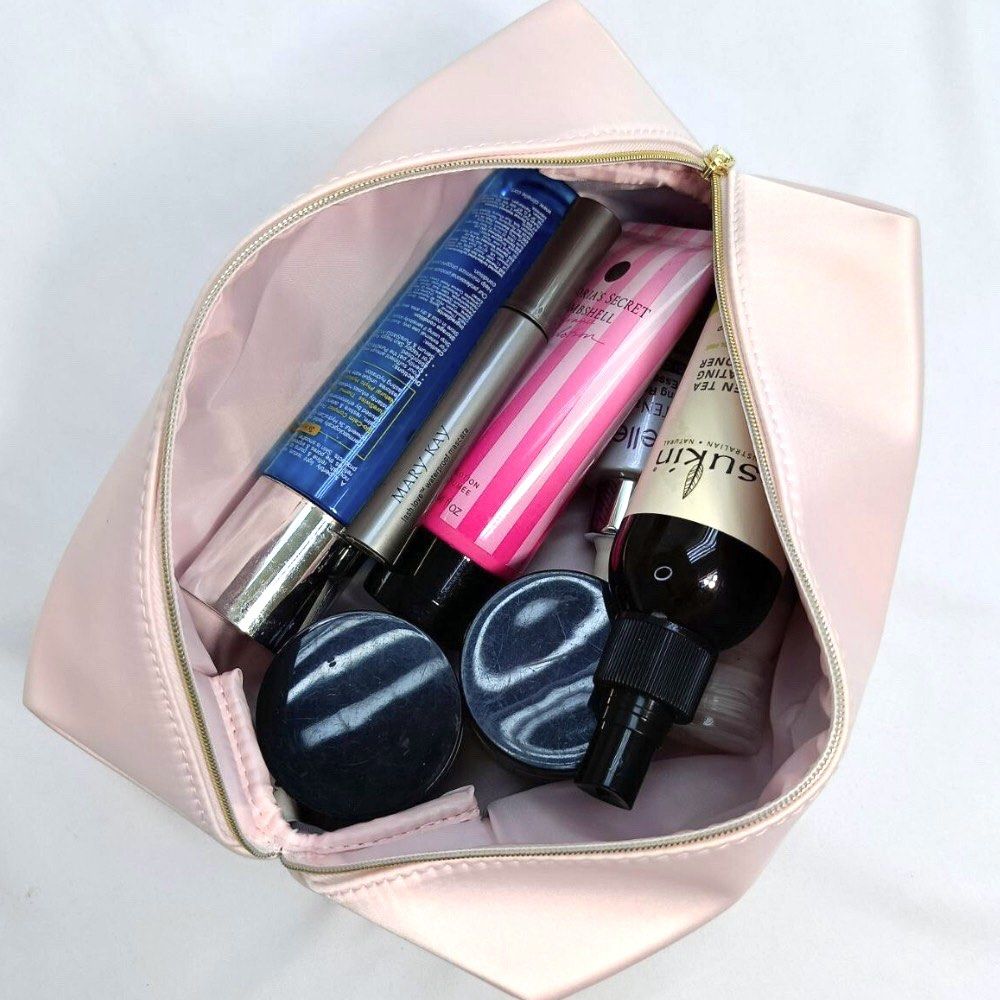 Coach Pink Make up Toiletry Bag (Category: Luxury Bags & Wallets) located in San Jose del Monte. Submitted by declothering_ph (Listing ID 1456500406, Image 3). Description: > From USA 🇺🇸 > Authentic pink Coach cosmetic bag > Pretty baby pink color! 💗 > Satin material > Comes with a silica gel packet > Spacious enough for makeup and toiletries > No issues.