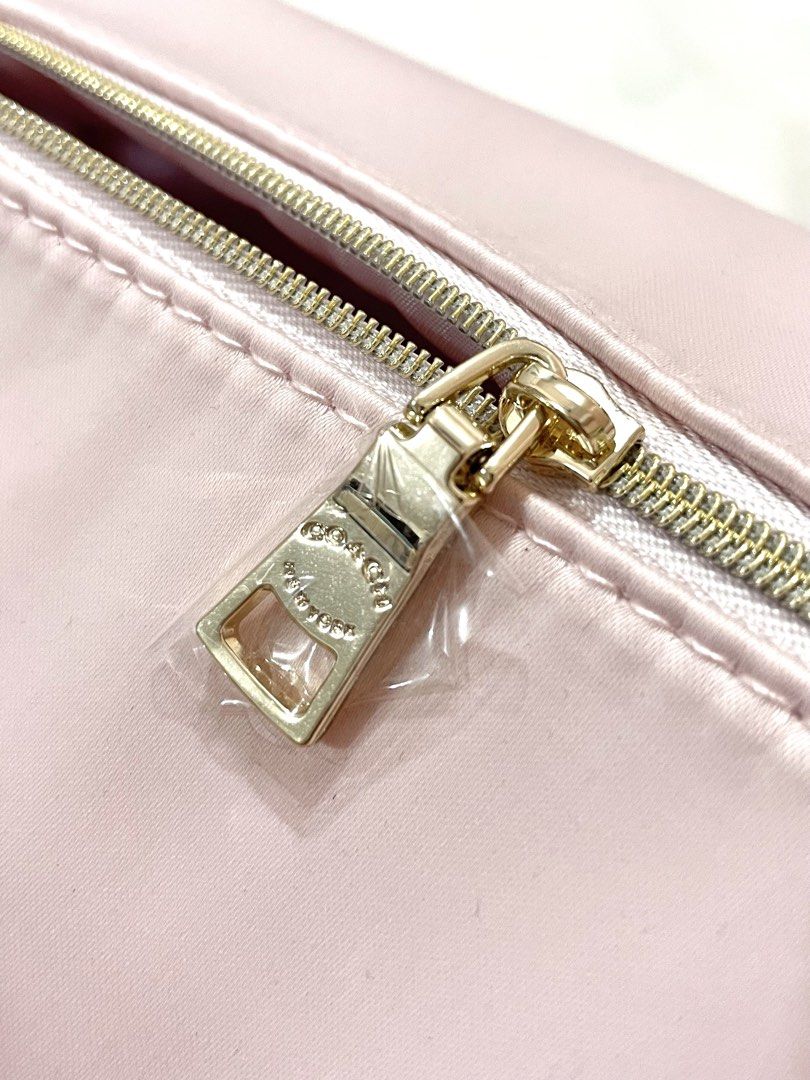 Coach Pink Make up Toiletry Bag (Category: Luxury Bags & Wallets) located in San Jose del Monte. Submitted by declothering_ph (Listing ID 1456500406, Image 2). Description: > From USA 🇺🇸 > Authentic pink Coach cosmetic bag > Pretty baby pink color! 💗 > Satin material > Comes with a silica gel packet > Spacious enough for makeup and toiletries > No issues.