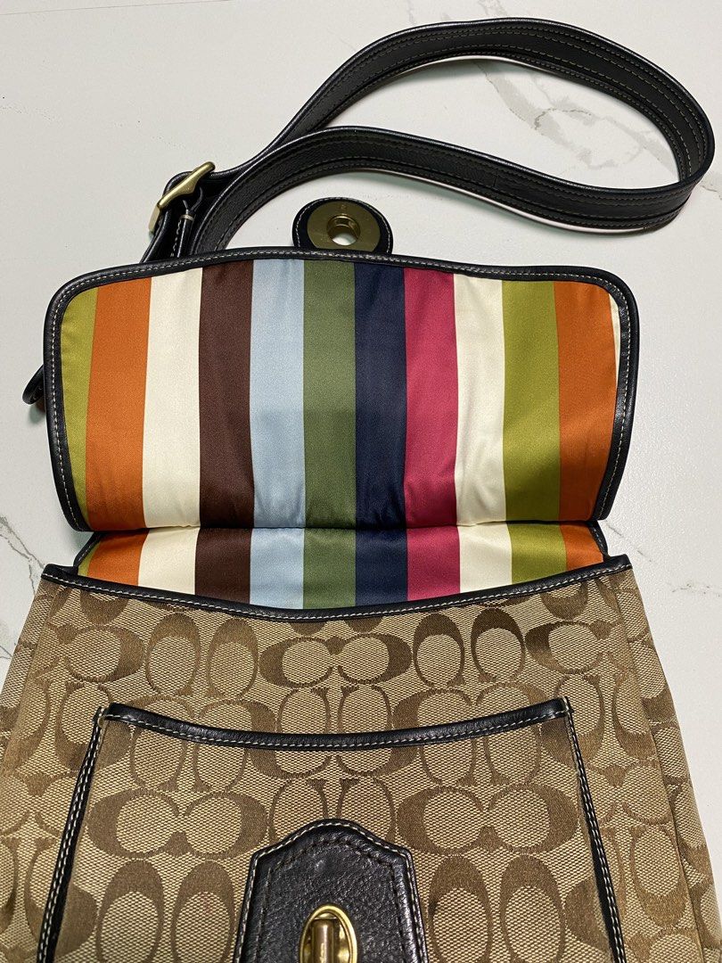 Coach Legacy (Category: Luxury Bags & Wallets) located in Balagtas. Submitted by dadalalashop (Listing ID 1456590329, Image 3). Description: - Classic Coach shoulder bag - Signature C canvas with black leather trim - Secure turn-lock closure - Colorful striped interior lining - Adjustable shoulder strap - Ideal for everyday use.