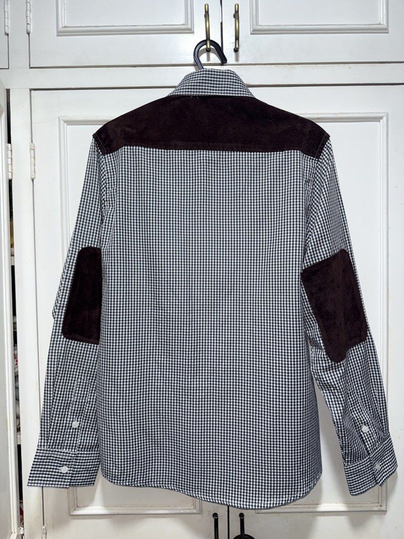Commes Des Garçons MAN Junya Watanabe Polo (Category: Formal Shirts) located in Muntinlupa City. Submitted by madssounds (Listing ID 1456461359, Image 2). Description: This is a Junya Watanabe Comme des Garçons MAN black and white gingham check button-up shirt featuring contrasting round collars, shoulder yokes, and prominent elbow patches. Second-hand, but never worn on my end (it was too small ;<) Tag says XL but realistically the size is proba