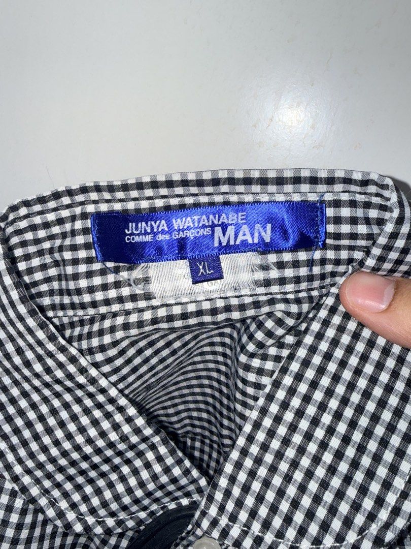 Commes Des Garçons MAN Junya Watanabe Polo (Category: Formal Shirts) located in Muntinlupa City. Submitted by madssounds (Listing ID 1456461359, Image 3). Description: This is a Junya Watanabe Comme des Garçons MAN black and white gingham check button-up shirt featuring contrasting round collars, shoulder yokes, and prominent elbow patches. Second-hand, but never worn on my end (it was too small ;<) Tag says XL but realistically the size is proba