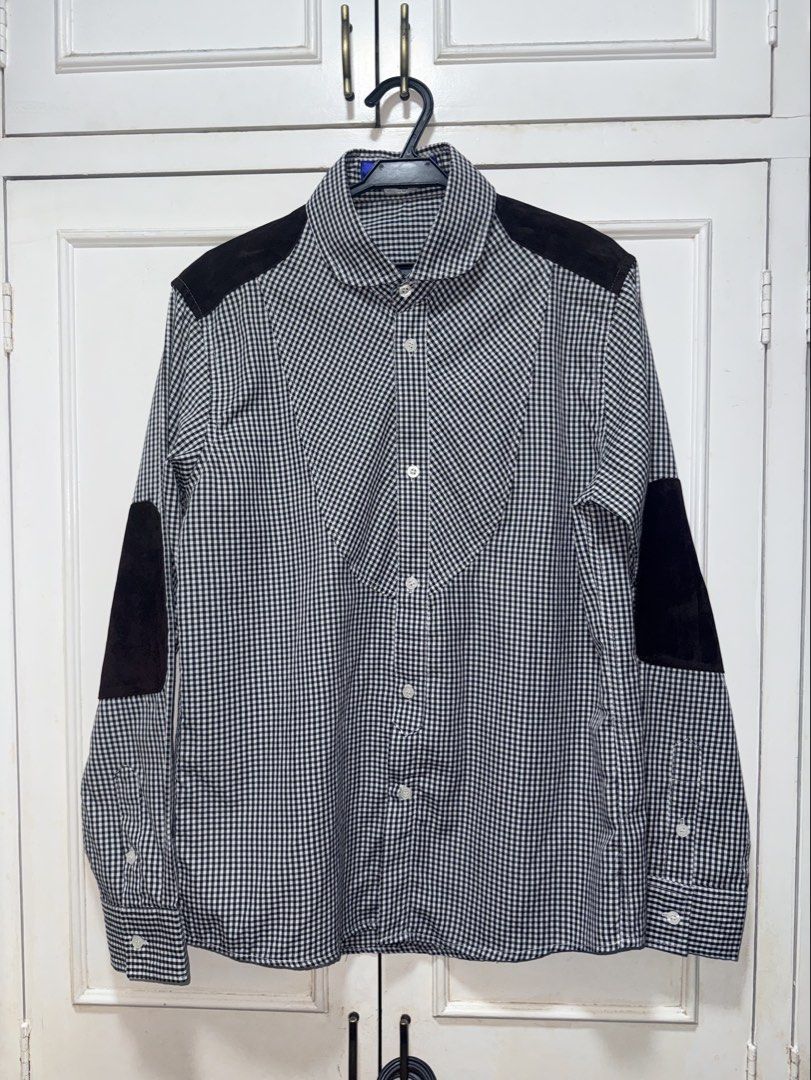 Commes Des Garçons MAN Junya Watanabe Polo (Category: Formal Shirts) located in Muntinlupa City. Submitted by madssounds (Listing ID 1456461359, Image 1). Description: This is a Junya Watanabe Comme des Garçons MAN black and white gingham check button-up shirt featuring contrasting round collars, shoulder yokes, and prominent elbow patches. Second-hand, but never worn on my end (it was too small ;<) Tag says XL but realistically the size is proba