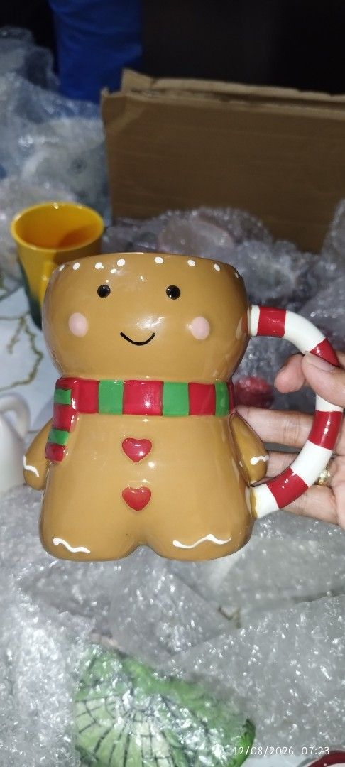Cute Gingerbread Man Christmas Mug with Candy Cane Handle (Category: Coffee & Tea Tableware) located in Manila. Submitted by silverwhale_cafa21 (Listing ID 1456598919, Image 1). Description: - Adorable gingerbread man design - Fun candy cane handle - Ideal for hot cocoa, coffee, or other holiday drinks - Makes a wonderful gift or festive kitchen addition - Hand wash recommended for longevity - Approximately X inches in height.
