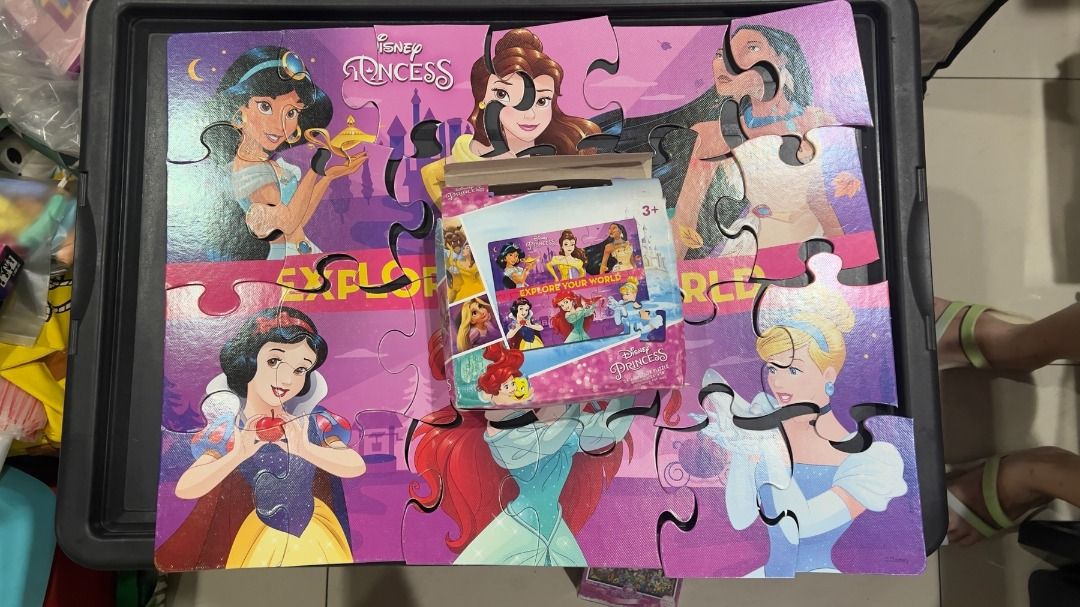 Disney Princess Jigsaw Puzzle (Category: Board Games & Puzzles) located in Manila. Submitted by elcanomnlfinds (Listing ID 1456506851, Image 1). Description: - Features popular Disney Princesses: Jasmine, Snow White, Belle, Pocahontas, and Cinderella. - Includes original box insert showing the princesses. - A fun and engaging activity for young Disney fans. - Perfect for developing problem-solving skills and fine motor coordination. - CONDITION: 