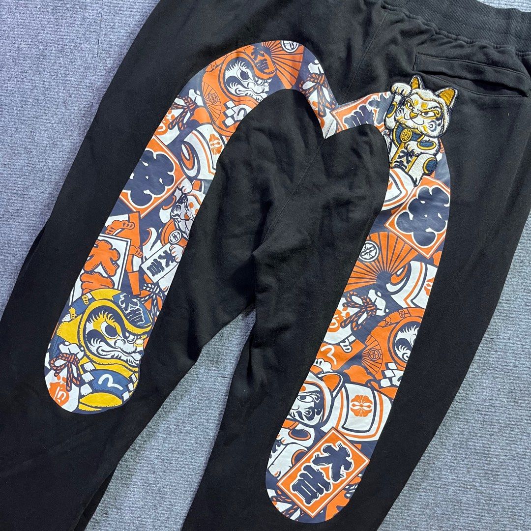 EVISU DAICOCK (Category: Joggers) located in Panabo. Submitted by bae.sick_thirft (Listing ID 1456567145, Image 3). Description: EVISU DARUMA PATTERN DAICOCK‼️ • Condition - Excellent • Issue - None • Color rate - 9.2/10 • Fave Dimes : Waist - Adjustable (with lace) Lenght - 40 Leg op - 6 Thigh - 14 BID AT YOUR OWN RISK FLAKERS WILL BE POSTED⚠️.