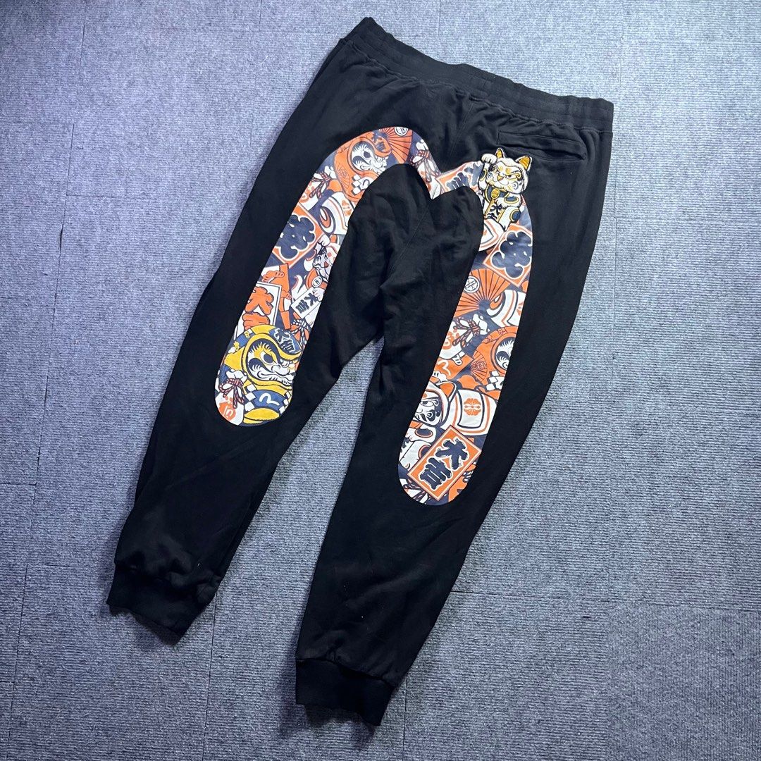 EVISU DAICOCK (Category: Joggers) located in Panabo. Submitted by bae.sick_thirft (Listing ID 1456567145, Image 1). Description: EVISU DARUMA PATTERN DAICOCK‼️ • Condition - Excellent • Issue - None • Color rate - 9.2/10 • Fave Dimes : Waist - Adjustable (with lace) Lenght - 40 Leg op - 6 Thigh - 14 BID AT YOUR OWN RISK FLAKERS WILL BE POSTED⚠️.