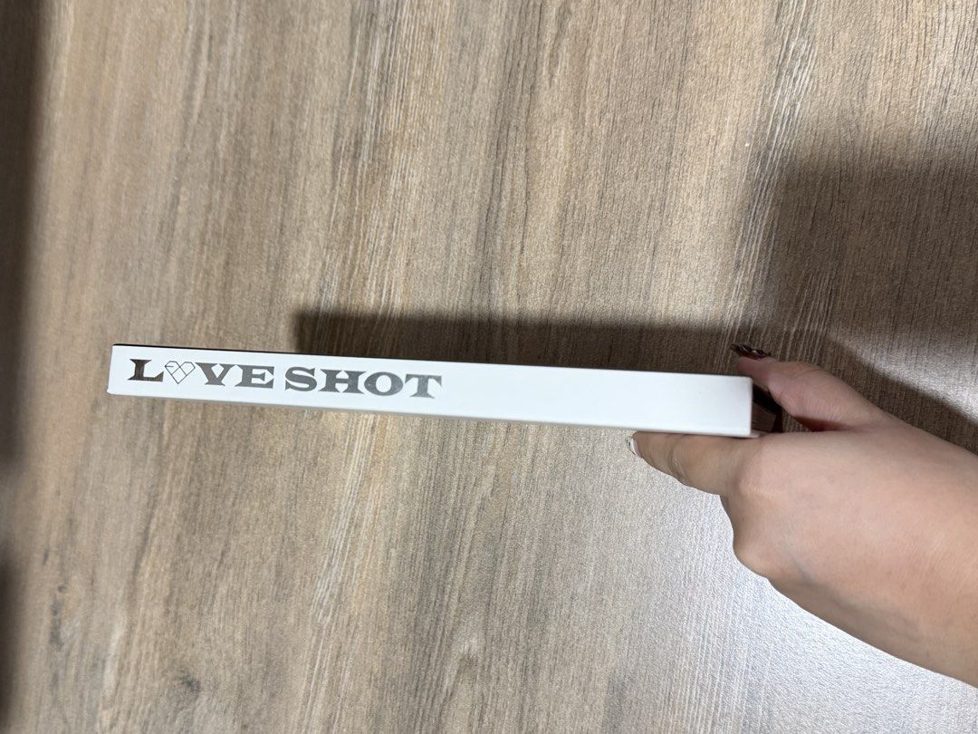 Exo Love Shot, Love Version Album (Category: CDs & DVDs) located in Pasig City. Submitted by mendd (Listing ID 1456474105, Image 2). Description: photobook and cd.