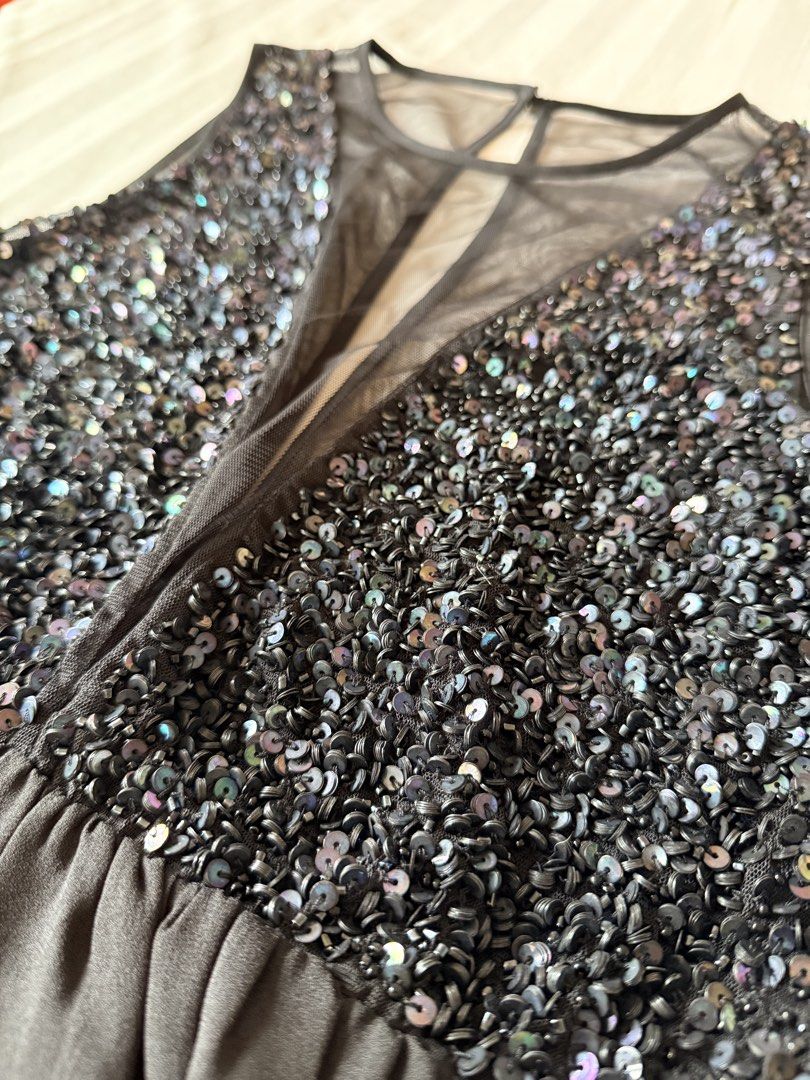 Forever 21 Black Sequin Mesh A-line Dress (Category: Dresses) located in Muntinlupa City. Submitted by mmivs (Listing ID 1456474205, Image 2). Description: Brand: Forever 21 Size: US Medium - Plunging sheer illusion neckline - Sparkling sequin embellished bodice (looks midnight blue under certain angles) - Sheer mesh open back - Single button on top back closure - Garterized waist - See last photo for product model pic RFS: decluttering .