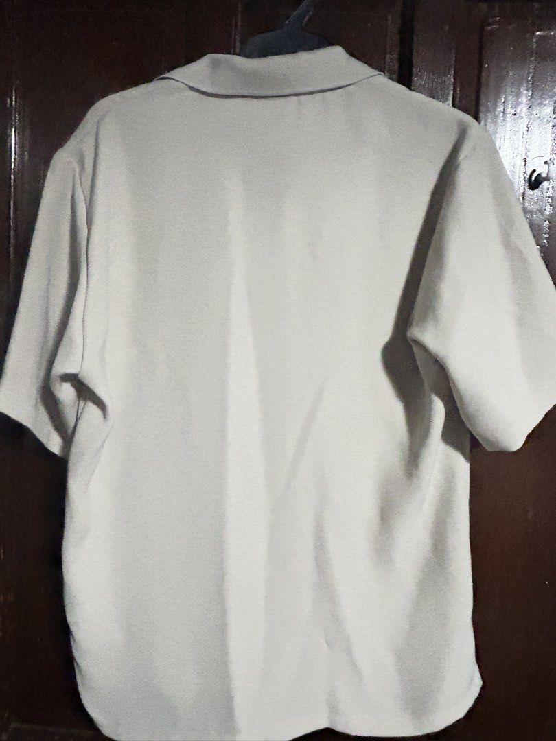 GU Short Sleeve Polo Shirt (Category: Tshirts & Polo Shirts ) located in Manila. Submitted by elo.decluttered (Listing ID 1456587520, Image 2). Description: - Beige short sleeve polo shirt from GU - Features a classic collar and button details at the neck - Tagged size S - Made of 100% polyester - Simple and versatile design, ideal for casual outfits.