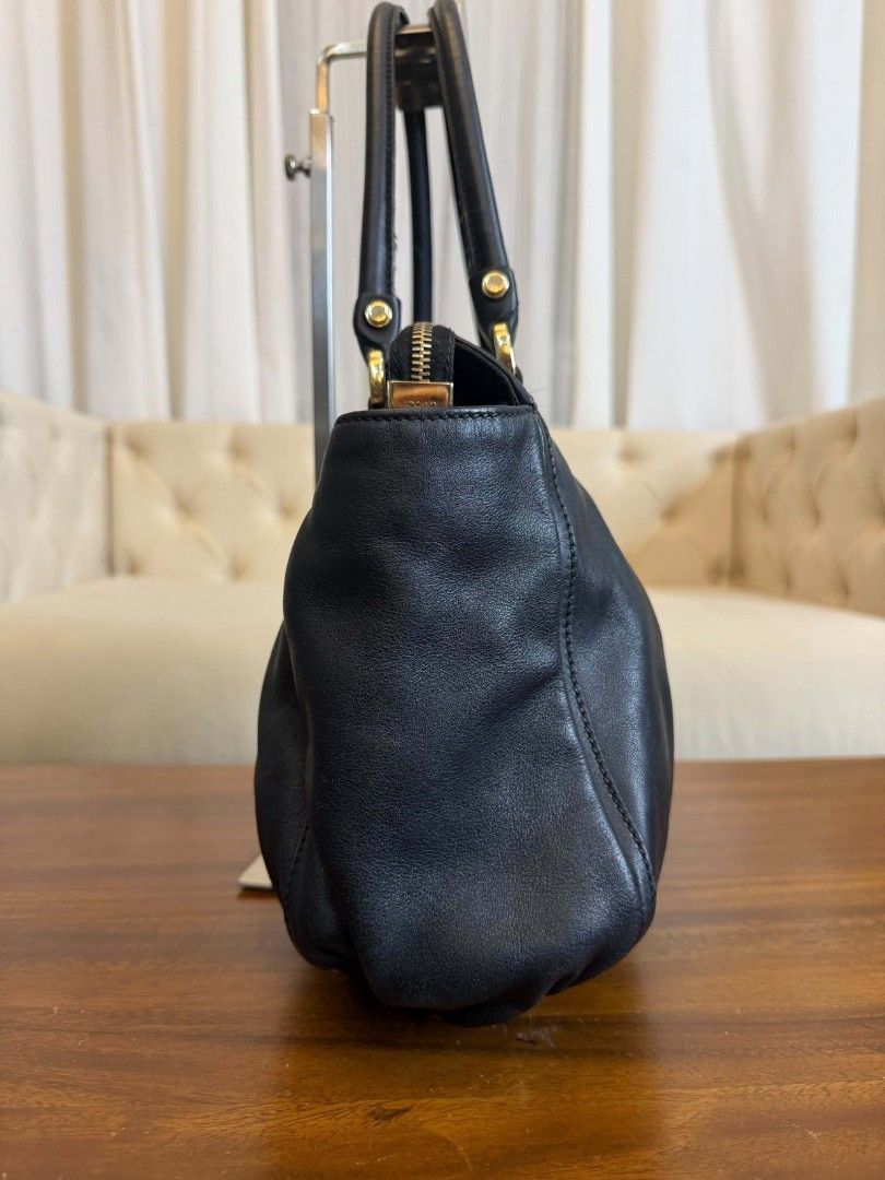 Gucci Black Leather D-Ring Tote Bag (Category: Luxury Bags & Wallets) located in Cavite. Submitted by snoopynewbzness27 (Listing ID 1456509952, Image 2). Description: - Authentic Black Leather Gucci Tote Bag - Signature D-ring detail at the front - Secure top zip closure - Comfortable double top handles - Elegant gold-tone hardware - Spacious interior for all your essentials - Ideal for everyday use and stylish errands.