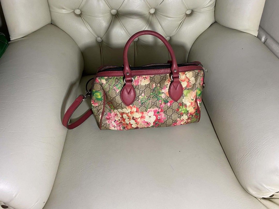 Gucci Monogram Floral Boston Bag (Category: Luxury Bags & Wallets) located in Manila. Submitted by vasttree.6bc15f (Listing ID 1456560619, Image 2). Description: - Gucci Boston Bag - Classic GG monogram with vibrant floral print - Red leather handles and strap - Versatile: can be worn as crossbody or shoulder bag - Secure zipper closure - Ideal for everyday use or travel.