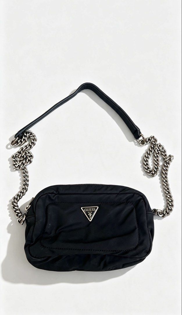 Guess Eco gemma camera cross body bag (Category: Cross-body Bags) located in Caloocan City. Submitted by mr.escobar (Listing ID 1456499933, Image 1). Description: This item is the Guess Eco Gemma Crossbody Camera Bag (or a similar variations from their nylon utility collections like the Guess Little Bay or Guess Sharma). It features a distinctive design heavily inspired by luxury multi-accessory utility pouches.