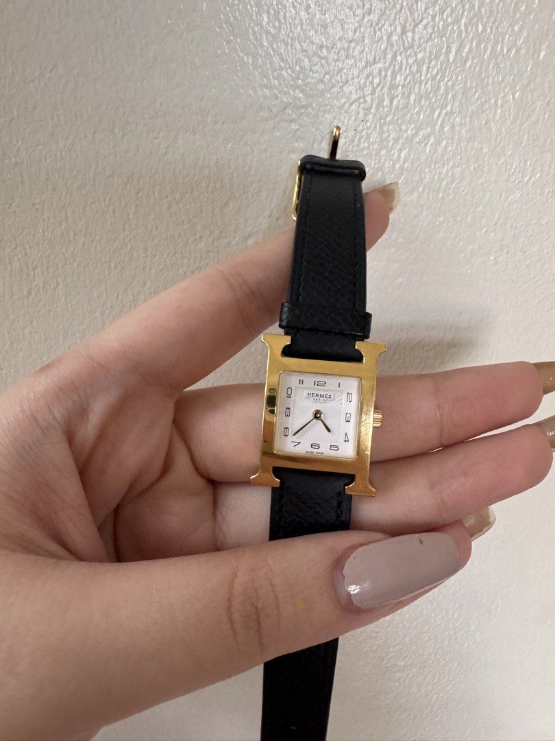 Hermes H Watch Gold Black Leather Strap (Category: Luxury Watches) located in San Jose. Submitted by jen10200 (Listing ID 1456586877, Image 3). Description: - Negotiable -Authentic Hermes H Hour watch - Gold plated case with white dial - Black leather strap with Hermes buckle - Iconic H design - Swiss made movement - Timeless and classic piece -Unit only - In perfect working condition.