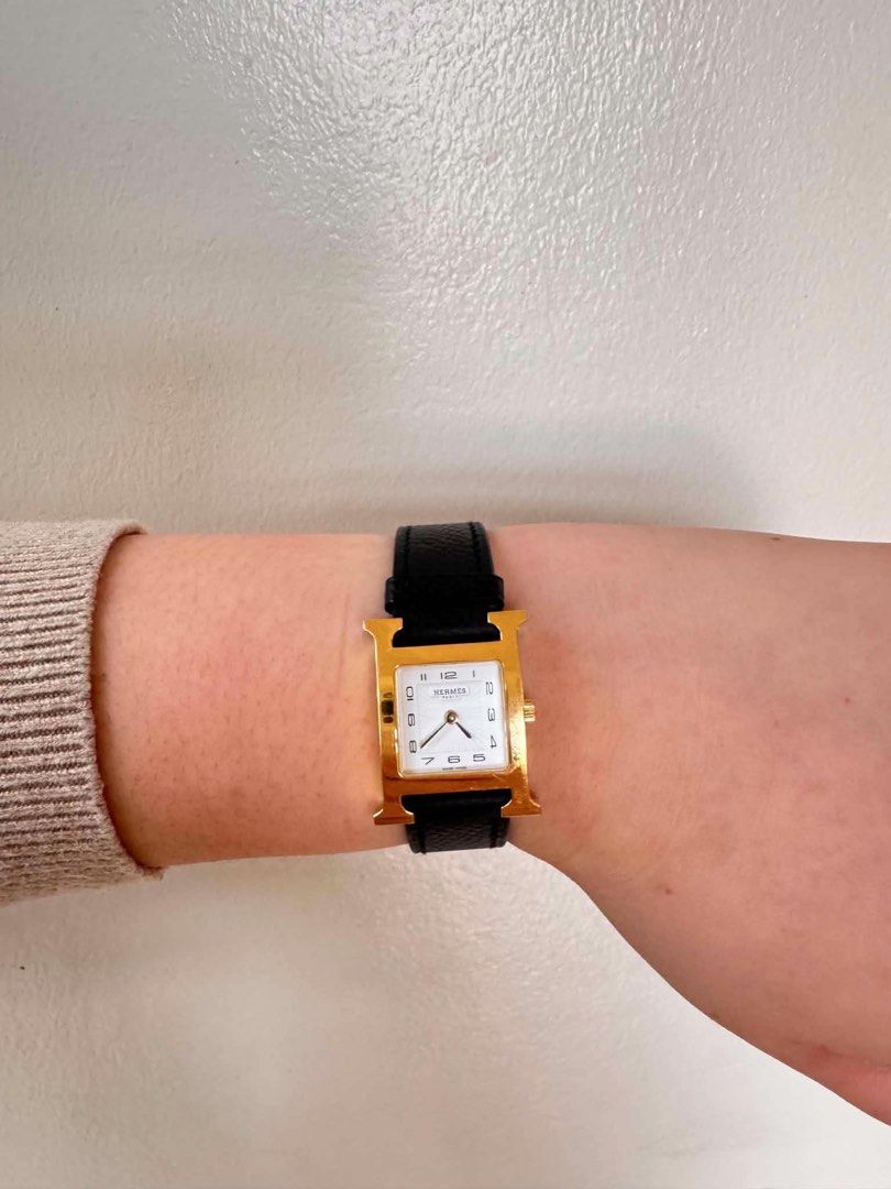 Hermes H Watch Gold Black Leather Strap (Category: Luxury Watches) located in San Jose. Submitted by jen10200 (Listing ID 1456586877, Image 1). Description: - Negotiable -Authentic Hermes H Hour watch - Gold plated case with white dial - Black leather strap with Hermes buckle - Iconic H design - Swiss made movement - Timeless and classic piece -Unit only - In perfect working condition.
