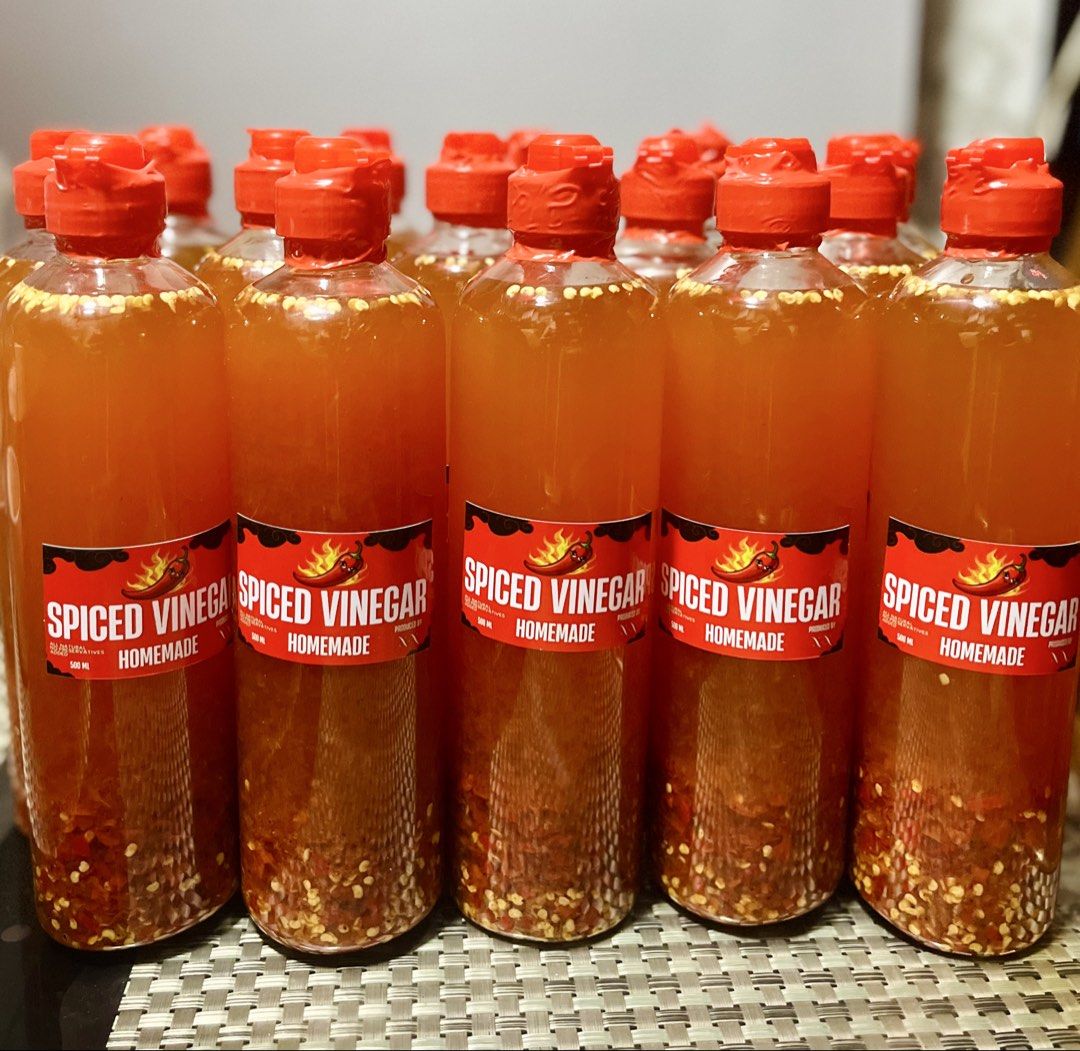 Homemade Spiced Vinegar - 500ml Bottles (Category: Spice & Seasoning) located in Valenzuela. Submitted by v_carla (Listing ID 1456531562, Image 2). Description: - Homemade Spiced Vinegar - 500ml bottle - Made with real chili flakes for an extra kick - Ideal for marinades, dipping sauces, and enhancing dishes.