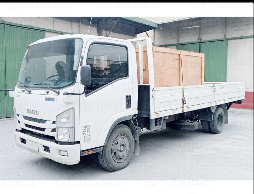 ISUZU NQR75 (Category: Heavy Vehicles) located in Pasig City. Submitted by quickshark.52a7c5 (Listing ID 1456436819, Image 3). Description: ISUZU NQR75 18FT x 7.5FT x 18 inches BODY TYPE: DROPSIDE AIRCON TYPE: AIR CONDITIONER CLASSIFICATION: PRIVATE (COMPANY TRUCK) Issue: There is rust on the truck bed (please see the photos). P.S. The truck is not used regularly, which is why the odometer is still at almost 20,000. It is only driven when there a