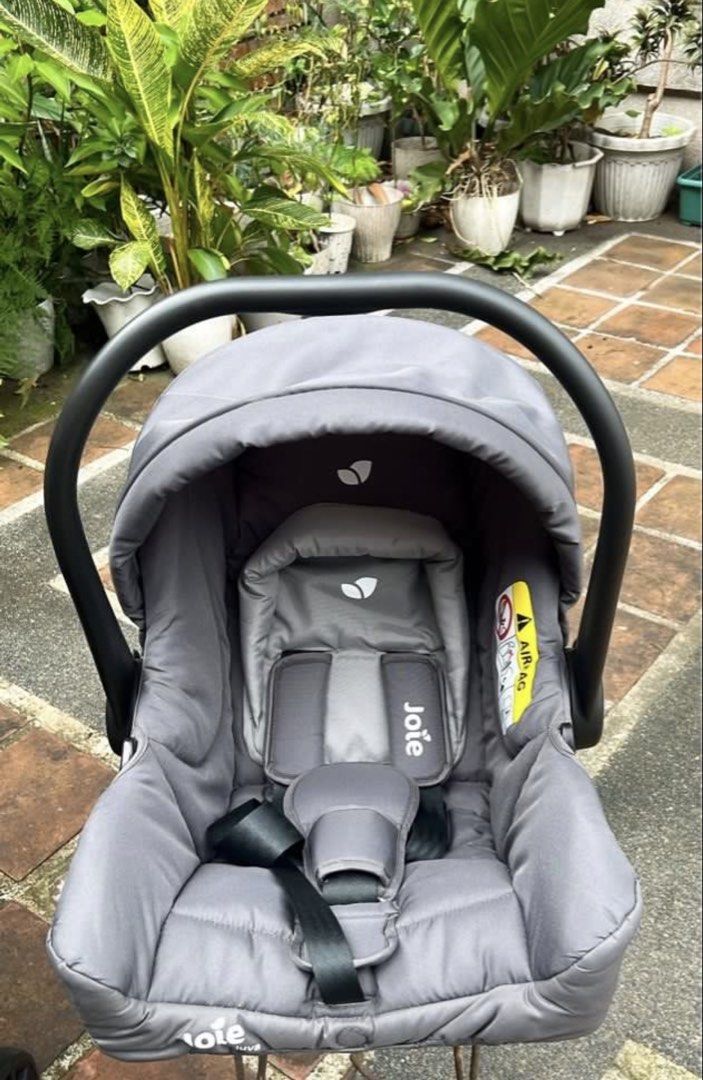 Joie Baby Carrier (Category: Car Seats) located in Del Monte. Submitted by shulamar (Listing ID 1456559277, Image 2). Description: - Grey Joie baby car seat - Secure 5-point harness - Adjustable canopy - Adjustable handle - Clean and well-maintained condition - Ready for your next journey!.