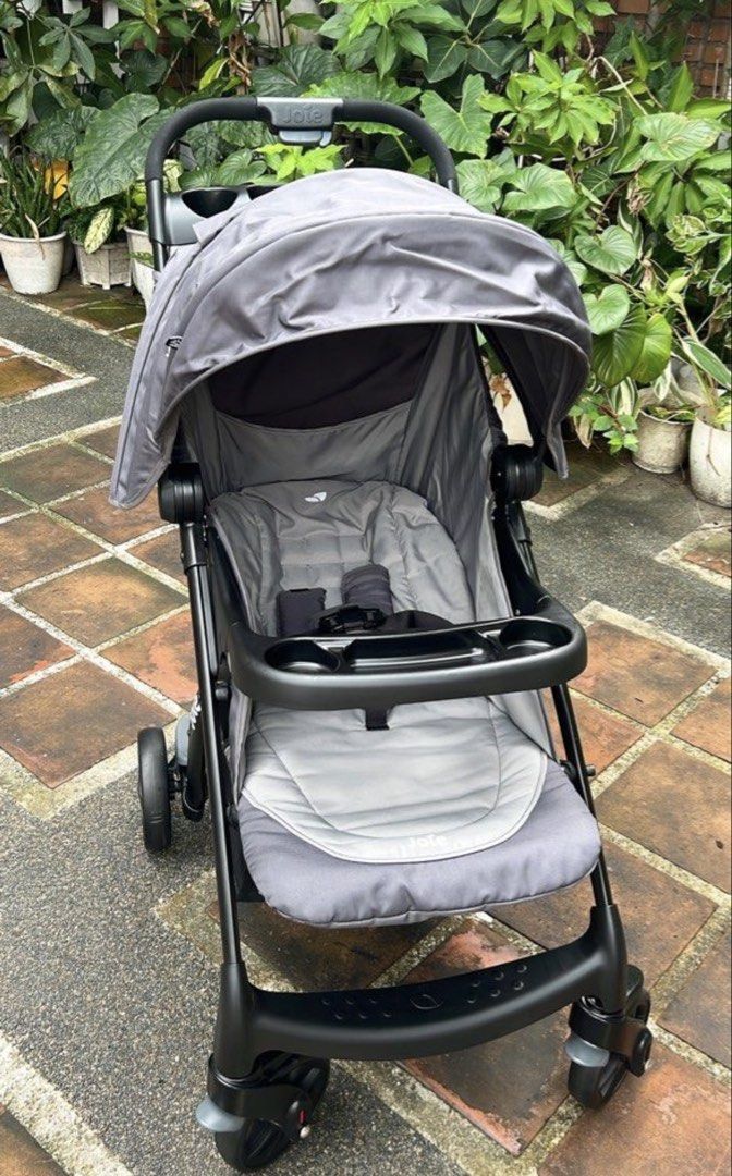 Joie Grey Baby Stroller (Category: Strollers) located in Del Monte. Submitted by shulamar (Listing ID 1456553022, Image 2). Description: - Grey Joie stroller - Includes canopy and tray - Convenient storage basket underneath - Easy to maneuver and push - Folds compactly for storage - Ideal for daily walks and errands.