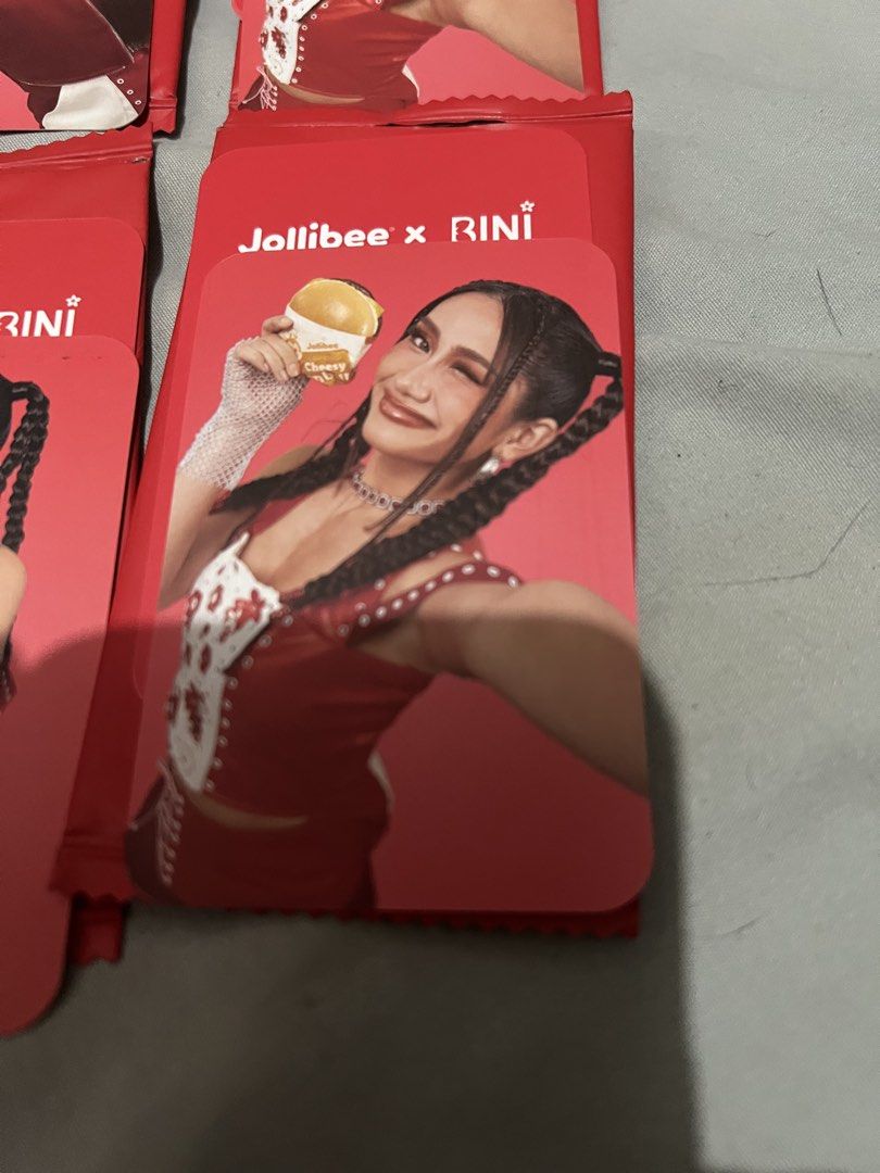 Jollibee X BINI V1 Photocards (Category: Raw Singles) located in Paranaque City. Submitted by ekkostarfall.12902 (Listing ID 1456600643, Image 2). Description: - V1 photocards - opened only - Gwen burger, Colet burger, Sheena burger, Stacy burger, Sheena heart - Each: 150 Take all: 80 MOP: Maya, Bank Transfer SF shouldered by buyer Parañaque.