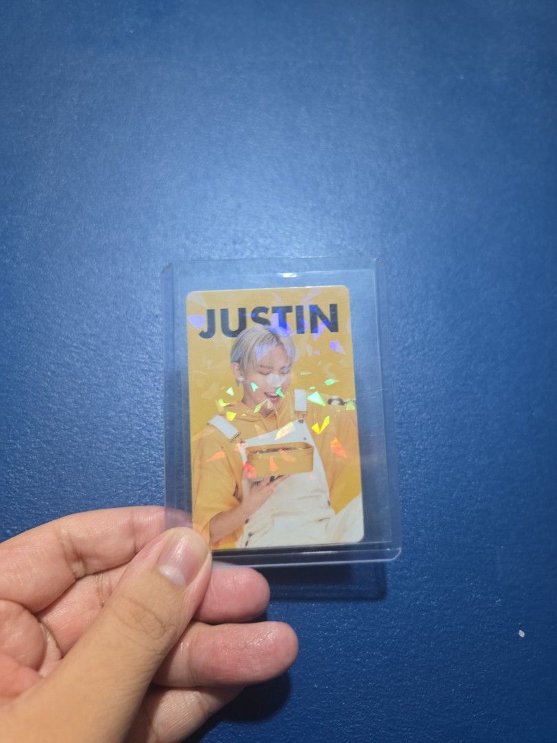 Justin Holographic Photocard (Category: Raw Singles) located in Rizal. Submitted by imnotraf (Listing ID 1456551328, Image 1). Description: - Authentic Justin (SB19) photocard - Features a stunning holographic design - Eye-catching yellow background - 'JUSTIN' text printed vertically on the left side - Ideal addition to any fan's collection - Stored safely in a protective sleeve.