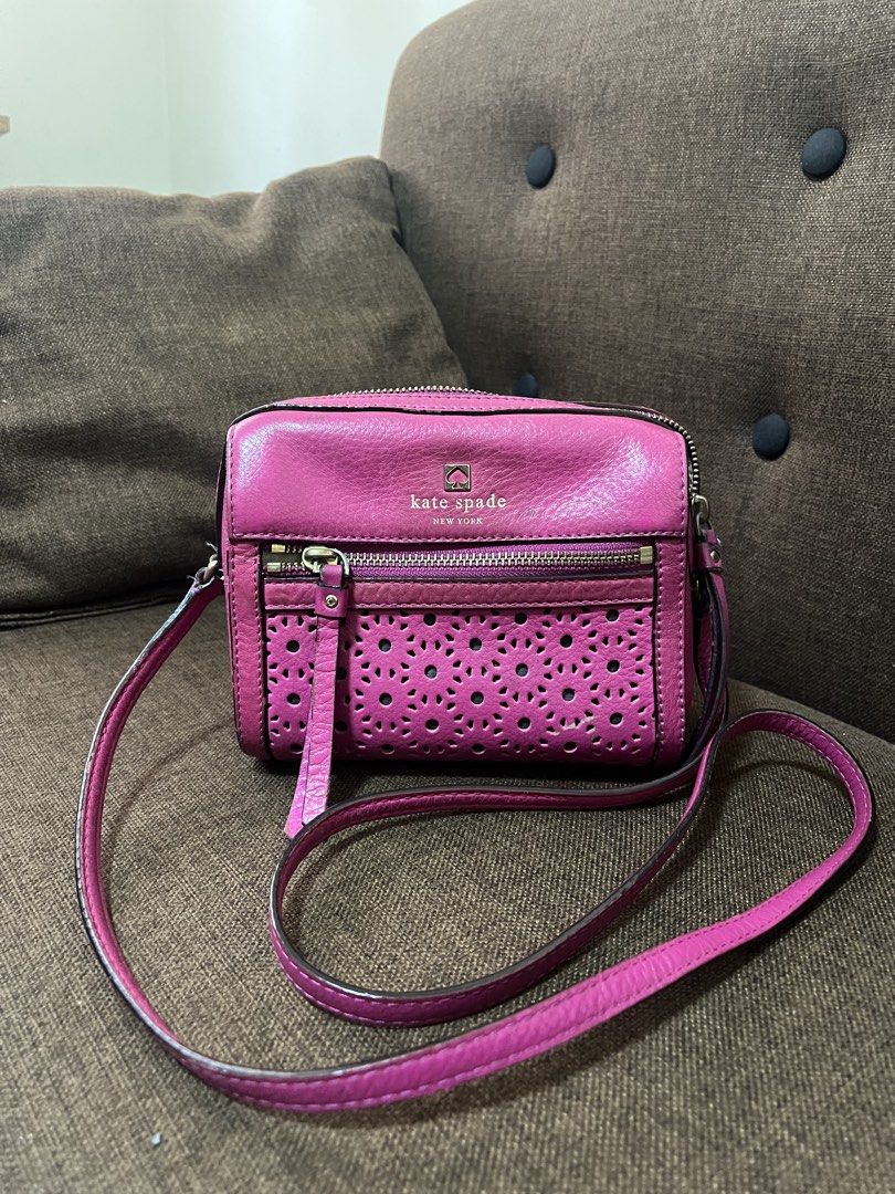 KATE SPADE BAG (Category: Luxury Bags & Wallets) located in Quezon City. Submitted by mscrybabyyy (Listing ID 1456482417, Image 1). Description: This is a Kate Spade New York crossbody bag (Perry Lane LooLoo) Type: Small crossbody / shoulder bag, made of pebbled leather with cut-out/perforated detailing. Color: Bright pink / peony pink. Features: long strap, front zip pocket, main top zip, and signature Kate Spade logo plaque. Style: Compact, eve