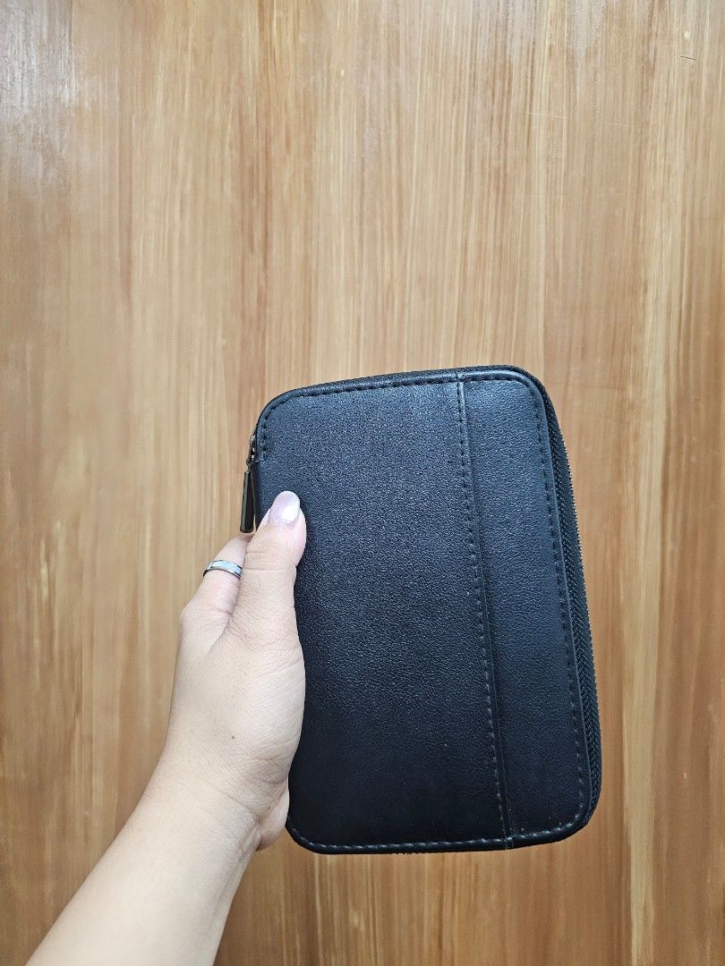 KEEP IT Black Leather Travel Wallet (Category: Wallets & Card holders) located in Paranaque City. Submitted by rhodalietagle (Listing ID 1456527333, Image 2). Description: - Black zip-around wallet - Front strap for easy carrying - 'KEEP IT' embossed on the front - Ideal for organizing cards and cash - Passport Holder.