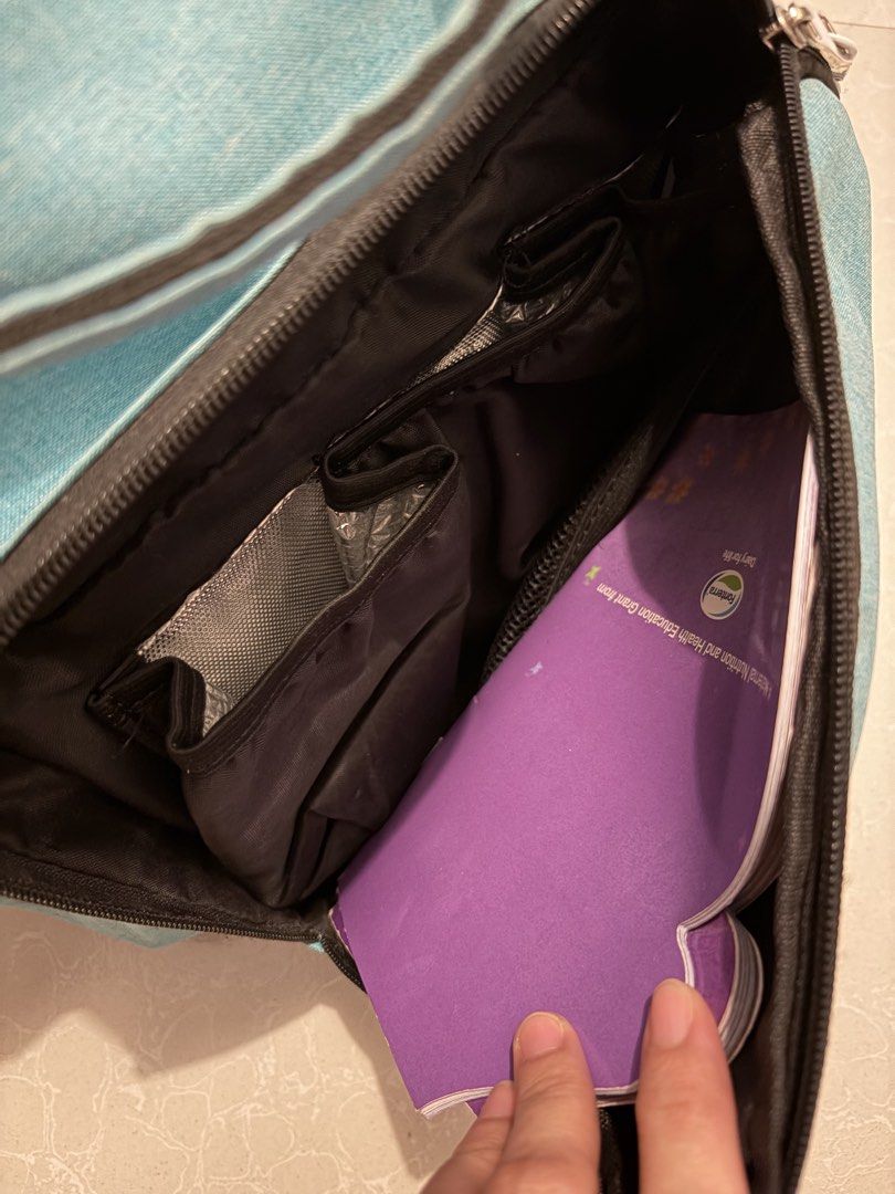 Kooshy Kids Baby Bag (Category: Diaper Bags & Wetbags) located in Las Pinas. Submitted by bibliomomma (Listing ID 1456514909, Image 3). Description: Kooshy Kids baby bag in turquoise. Spacious with a large main compartment, front zip pocket and side pockets, so there’s plenty of room for diapers, clothes, bottles and other baby essentials. Comes with sturdy handles and is easy to carry around. Pre-loved with some light signs of use, as shown in t