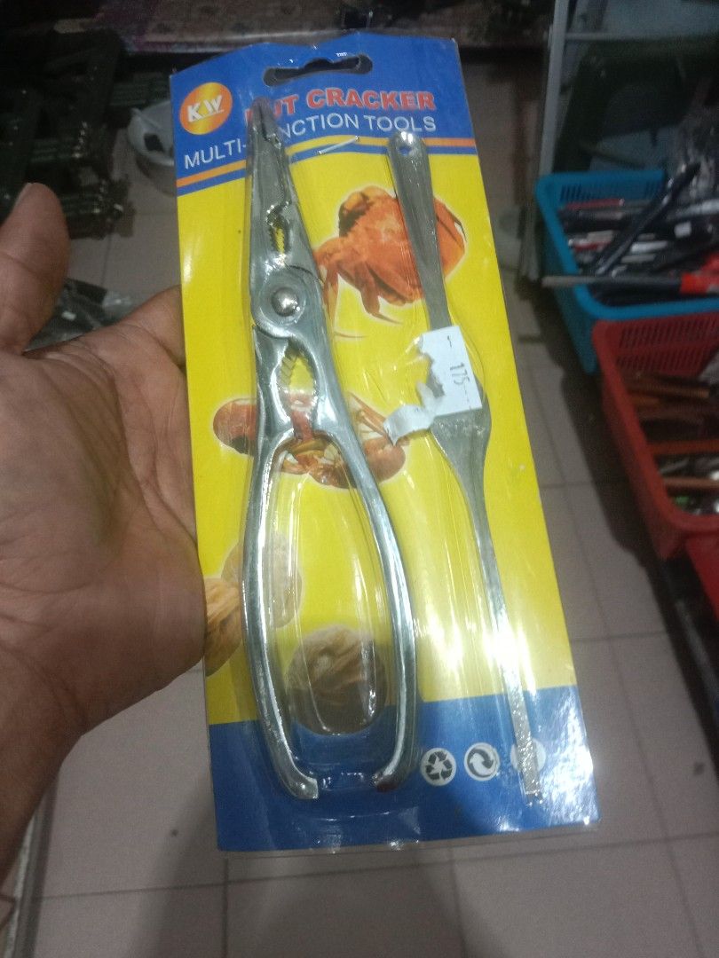 KW Nut Cracker Multi-Function Tools Set (Category: Craft Supplies & Tools) located in Tawau. Submitted by nellydali (Listing ID 1456489020, Image 2). Description: - KW Brand Nut Cracker & Multi-Function Tool - Perfect for cracking nuts and seafood - Comes with a handy fork for extracting meat - Made from durable metal for long-lasting use - An essential gadget for any kitchen.