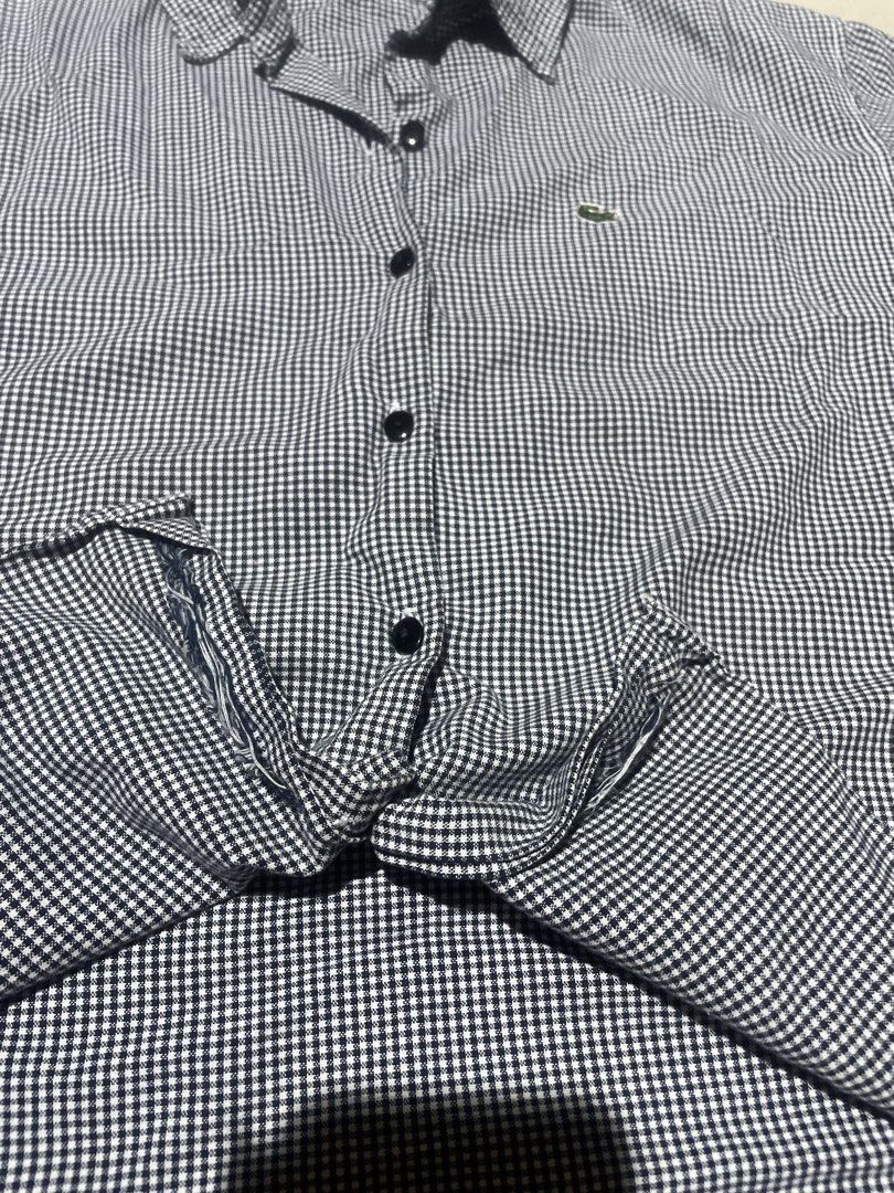 Lacoste Gingham Button Down Shirt (Category: Others Tops) located in Manila. Submitted by sapsari (Listing ID 1456518527, Image 2). Description: - Classic Lacoste button-down shirt - Black and white gingham pattern - size 42 on tag but best fit small to medium - complete button. -may small stain but washable naman.