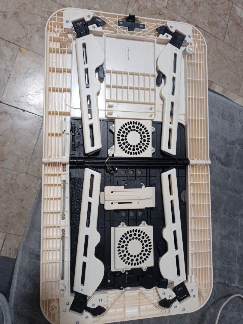 Laptop Desk Cooler (Category: Laptops & Notebooks) located in Manila. Submitted by zedddyxo (Listing ID 1456488283, Image 1). Description: - Brand: Roco - Type: Laptop Desk Cooler - Features: Dual built-in cooling fans - Design: Foldable for easy storage and transport - Built in mousepad - Adjustable legs for height - Functionality: Helps prevent laptop overheating - Condition: Used, good working condition - Meetup Location: Las Piñas City.